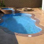 Laguna freeform inground fiberglass pool with curved freeform design for a residential backyard swimming pool